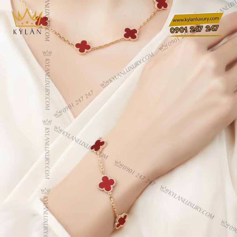 Lắc tay cỏ bốn lá vàng nguyên khối Au750 đính đá quý đỏ