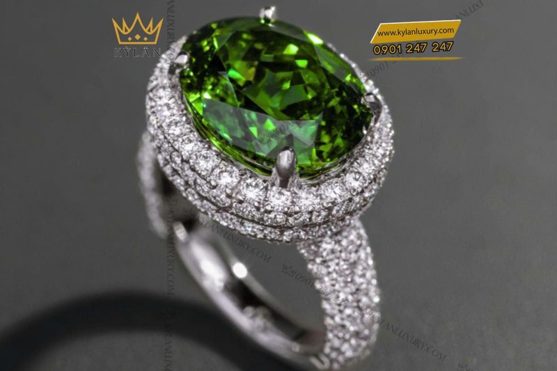 Nhẫn nữ vàng trắng nguyên khối Au750 đính viên chủ đá xanh
