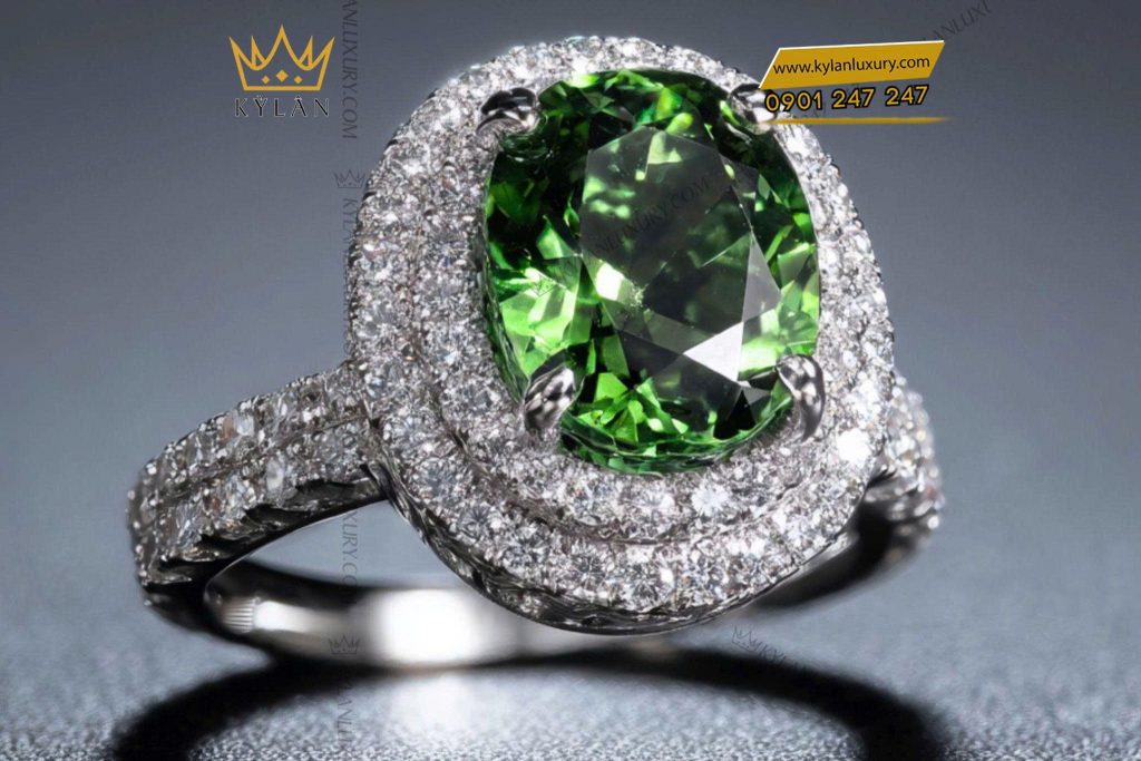 Nhẫn nữ kim cương vàng trắng nguyên khối Au750 đính viên chủ đá xanh