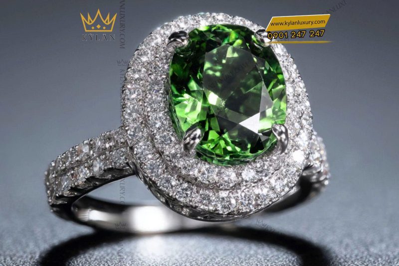 Nhẫn nữ vàng trắng nguyên khối Au750 đính viên chủ đá xanh