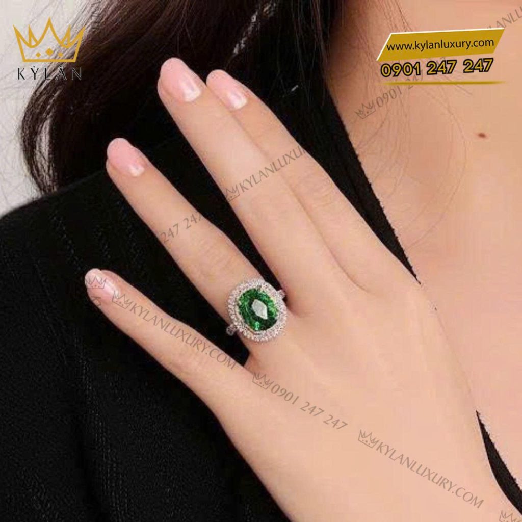 Nhẫn nữ vàng trắng nguyên khối Au750 đính viên chủ đá xanh