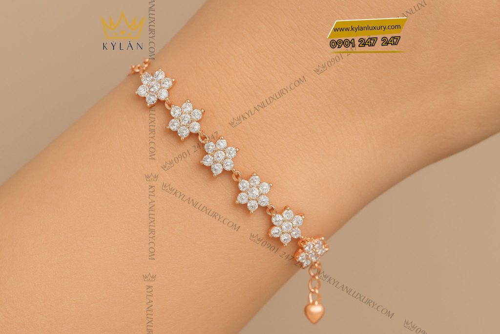 Lắc tay Hoa Tuyết vàng hồng nguyên khối Au750 đính kim cương