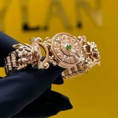 Lắc tay rồng vàng hồng nguyên khối Au750 đính đá xanh phong thủy