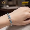 Lắc tay vàng trắng nguyên khối Au750 đính kim cương và đá quý