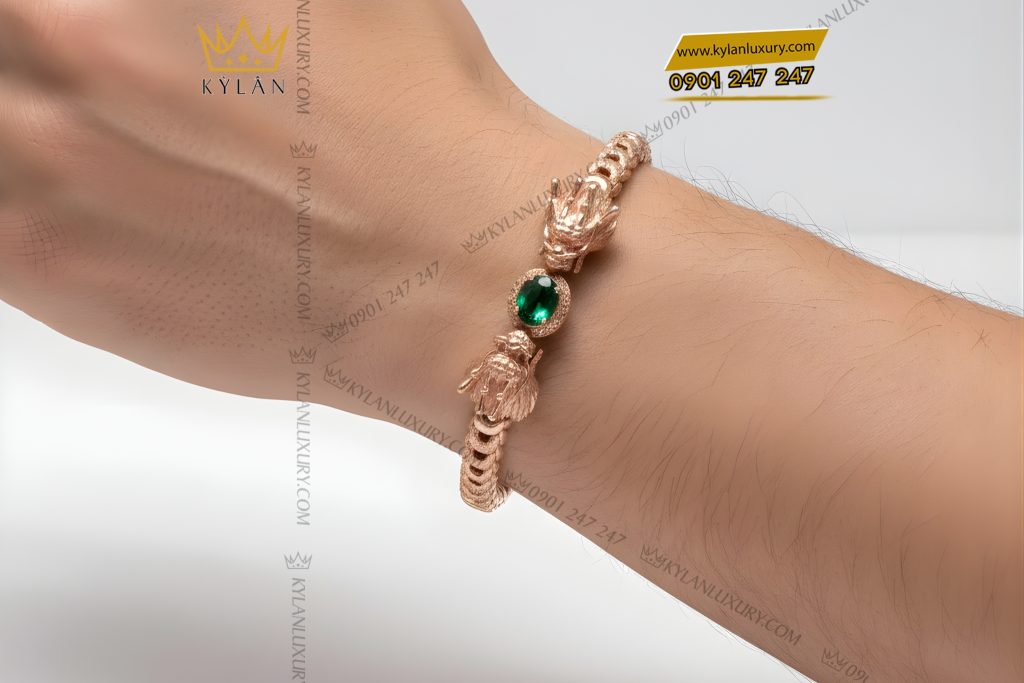 Lắc tay Rồng vàng hồng Au750 đính đá quý xanh