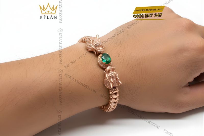 Lắc tay Rồng vàng hồng Au750 đính đá quý xanh