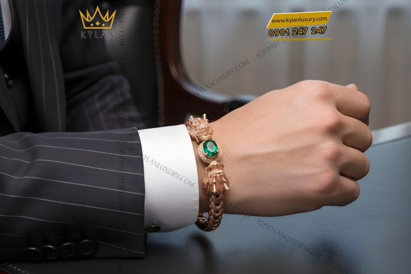 Lắc tay Rồng vàng hồng Au750 đính đá quý xanh