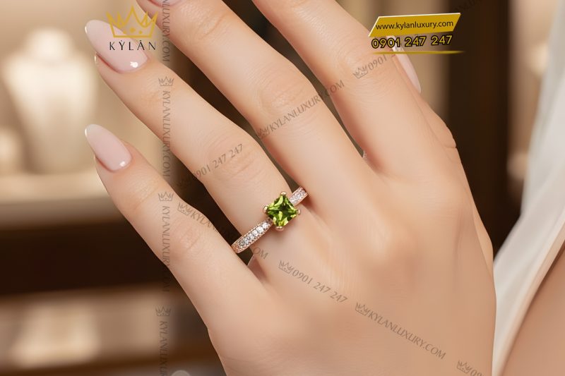 Nhẫn nữ vàng hồng Au750 đính kim cương và đá quý xanh