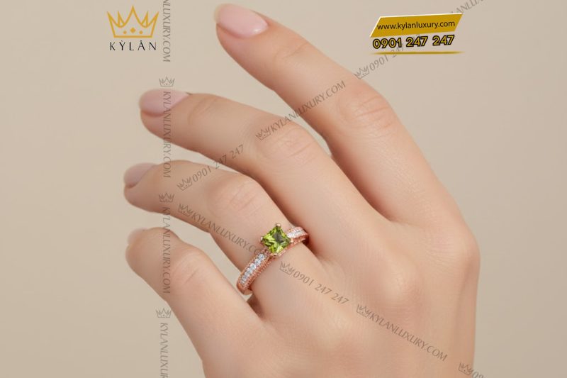 Nhẫn nữ vàng hồng Au750 đính kim cương và đá quý xanh
