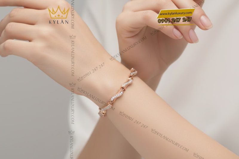 Lắc tay vàng hồng Au750 đính kim cương