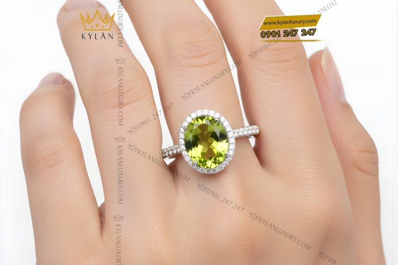 Nhẫn nữ vàng trắng Au750 đính kim cương và đá quý xanh