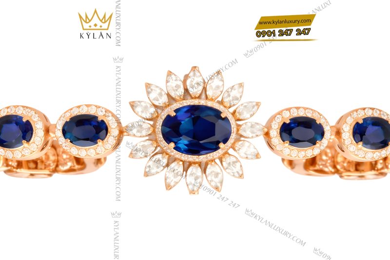 Lắc tay vàng hồng Au750 đính kim cương và đá quý xanh