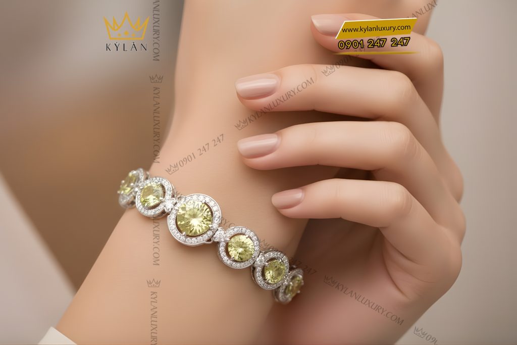 Lắc tay vàng trắng Au750 đính kim cương và đá quý xanh 