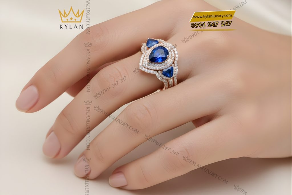 Nhẫn nữ vàng hồng Au750 đính kim cương và đá quý xanh