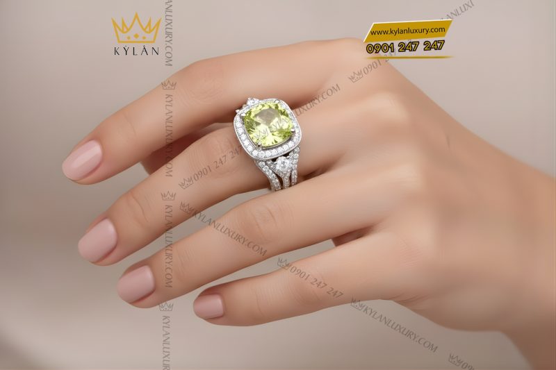 Nhẫn nữ vàng trắng Au750 đính kim cương và đá quý xanh