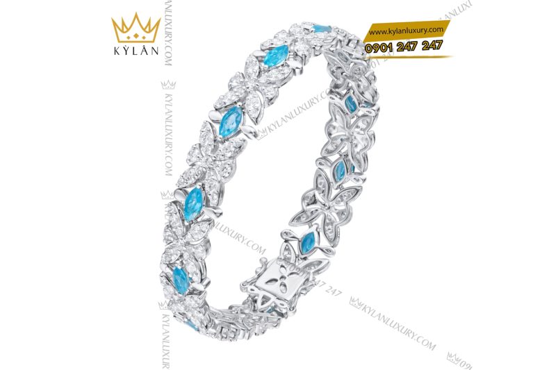 Lắc tay vàng trắng Au750 đính kim cương và đá Topaz