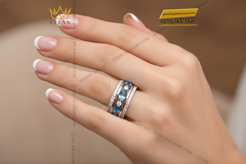 Nhẫn nữ vàng trắng Au750 đính kim cương và đá Topaz