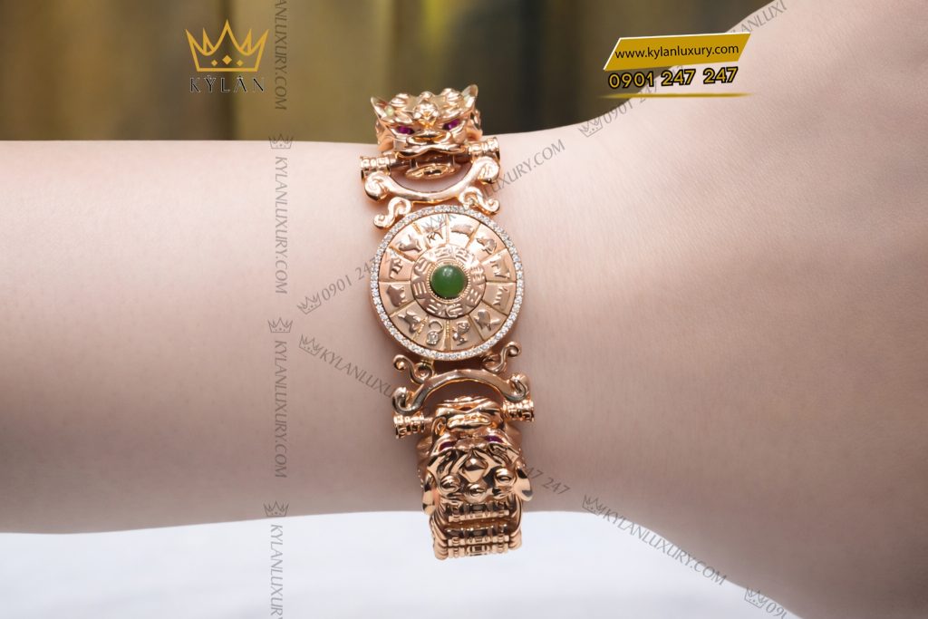 Lắc tay vàng hồng Au750 đính kim cương và ngọc lục bảo