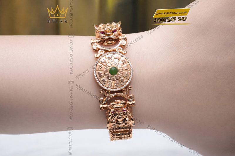 Lắc tay vàng hồng Au750 đính kim cương và ngọc lục bảo