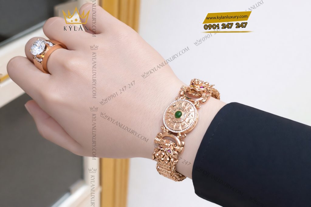 Lắc tay vàng hồng Au750 đính kim cương và ngọc lục bảo