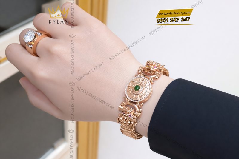 Lắc tay vàng hồng Au750 đính kim cương và ngọc lục bảo
