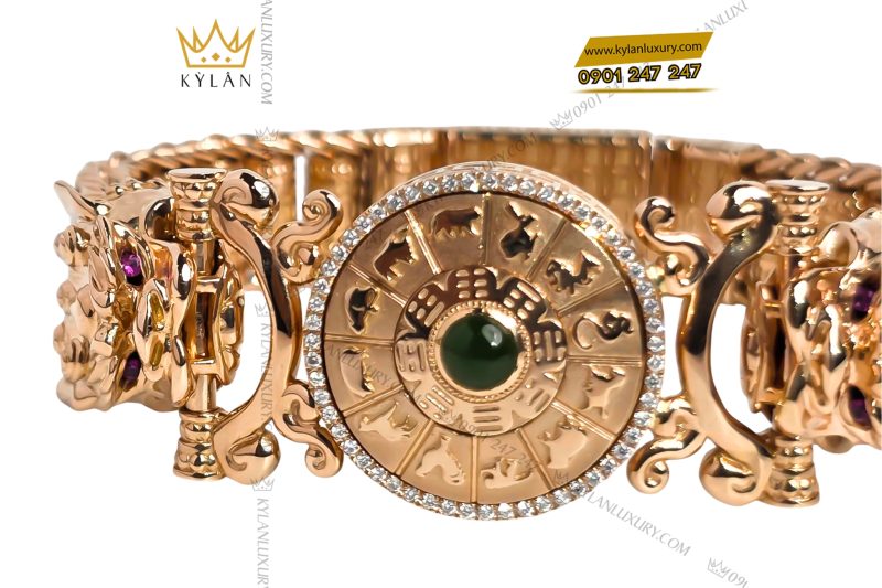 Lắc tay vàng hồng Au750 đính kim cương và ngọc lục bảo