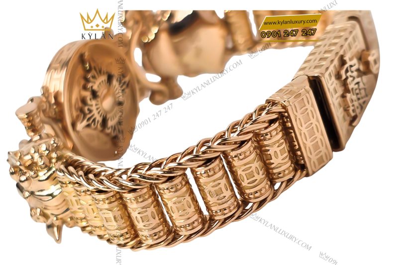 Lắc tay vàng hồng Au750 đính kim cương và ngọc lục bảo