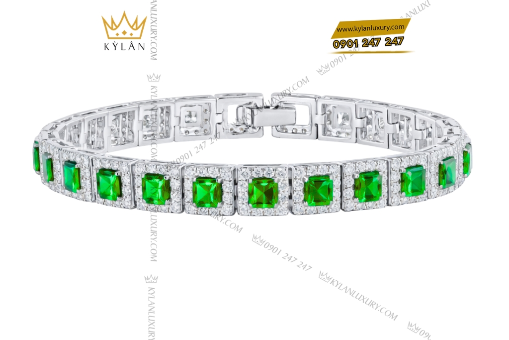 Lắc tay vàng trắng Au750 đính kim cương và đá lục bảo