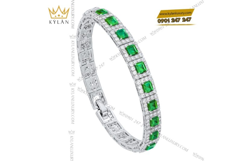Lắc tay vàng trắng Au750 đính kim cương và đá lục bảo