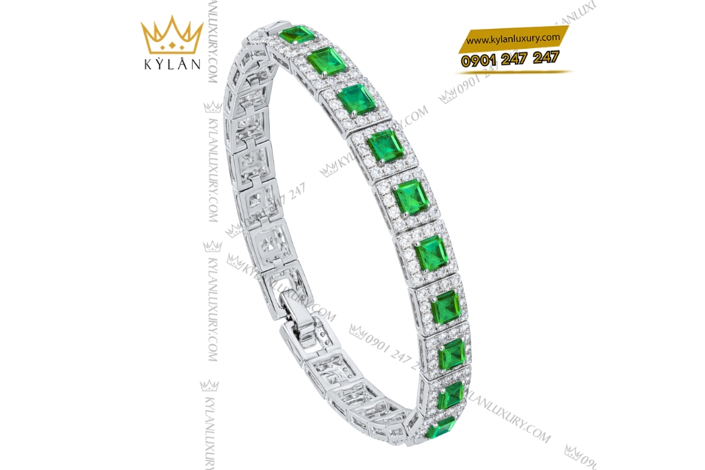 Lắc tay vàng trắng Au750 đính kim cương và đá lục bảo