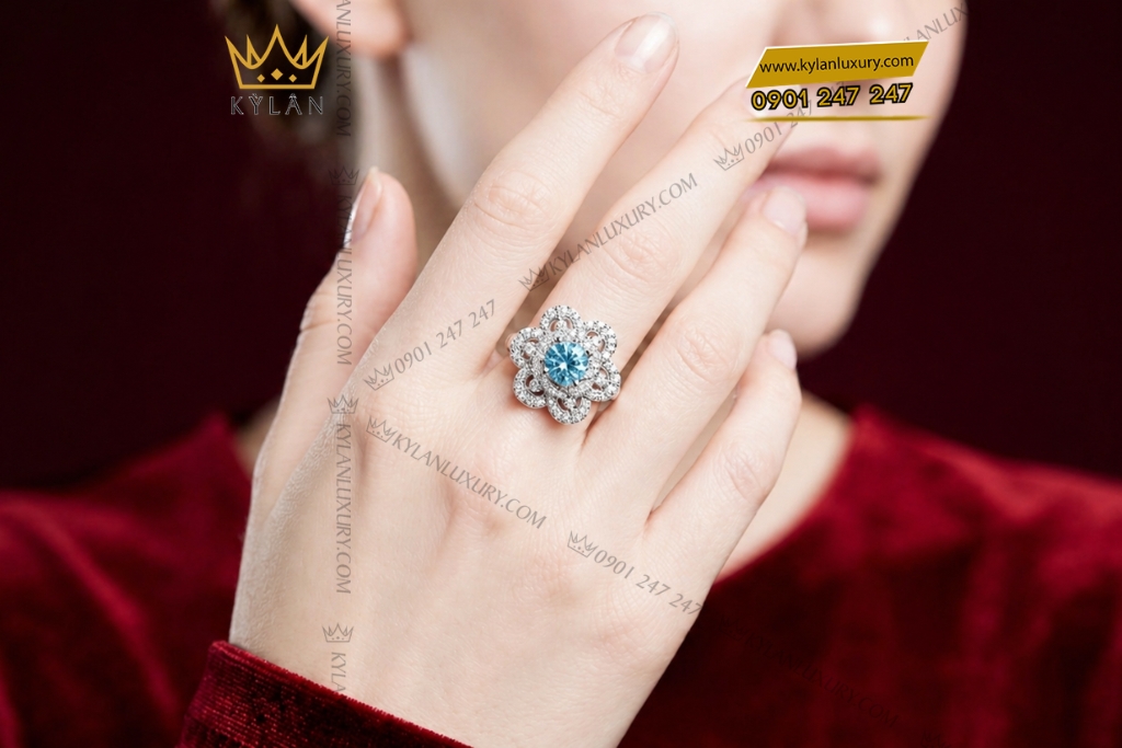 Nhẫn nữ vàng trắng Au750 đính kim cương và đá Topaz xanh