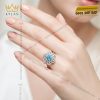 Nhẫn nữ vàng trắng Au750 đính kim cương và đá Topaz xanh
