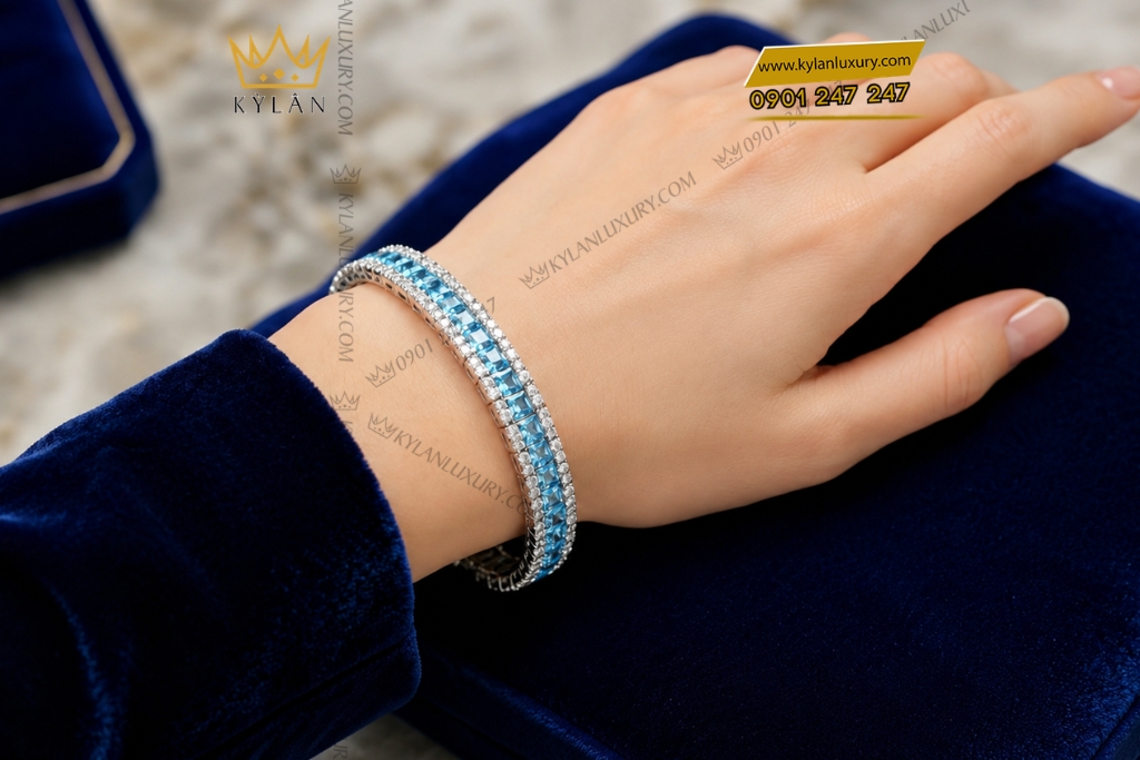 Lắc tay vàng trắng Au750 đính kim cương và đá Topaz