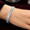 Lắc tay vàng trắng Au750 đính kim cương và đá Topaz