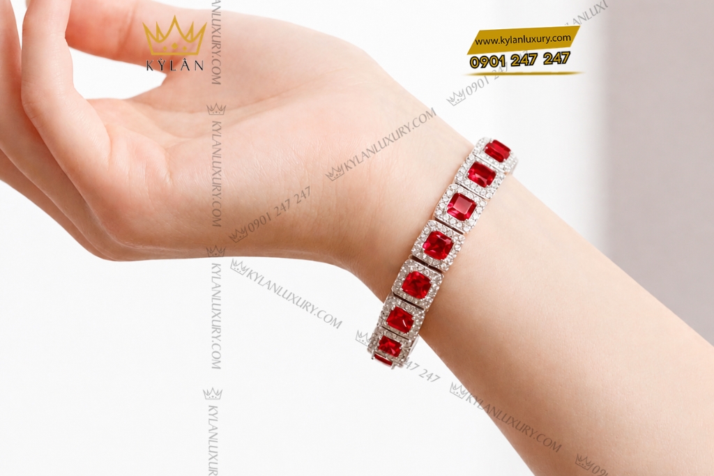 Lắc tay vàng trắng Au750 đính kim cương và sapphire đỏ