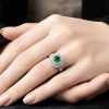 Nhẫn nữ vàng trắng Au750 đính kim cương và đá ngọc lục bảo