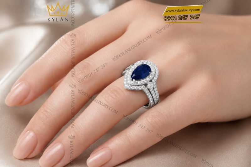 Nhẫn nữ vàng trắng Au750 đính kim cương và sapphire xanh dương