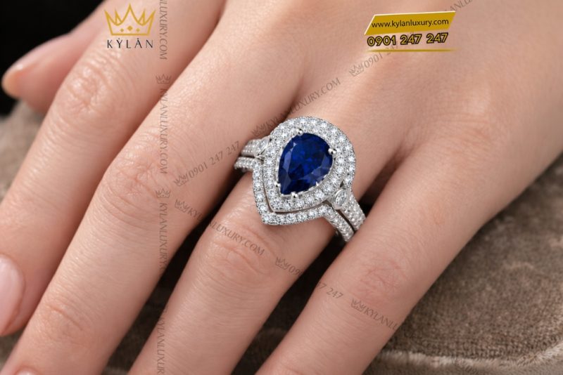 Nhẫn nữ vàng trắng Au750 đính kim cương và sapphire xanh dương