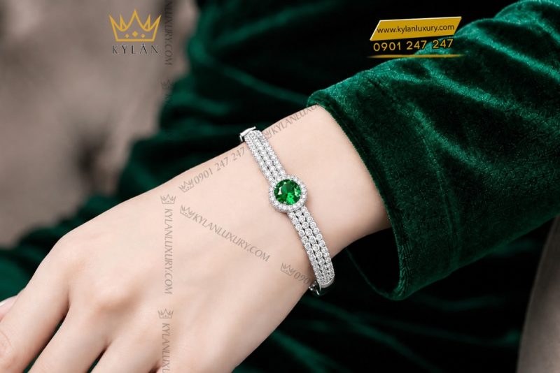 Vòng tay vàng trắng Au750 đính sapphire xanh lá