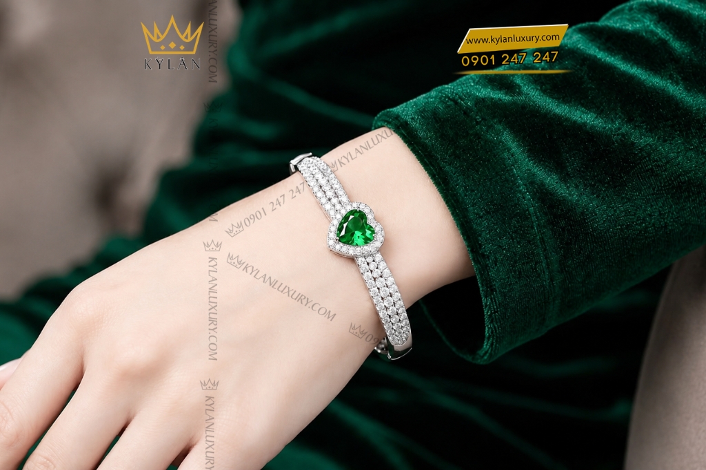 Vòng tay vàng trắng Au750 đính sapphire xanh lá